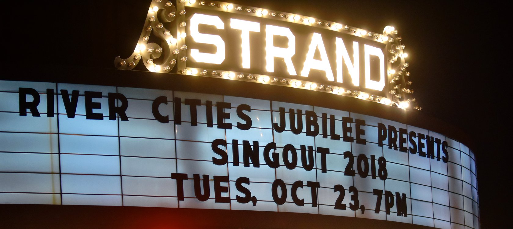 Text on marquee: “RIVER CITIES JUBILEE PRESENTS: • SINGOUT 2018 • TUES, OCT 23, 7PM”
